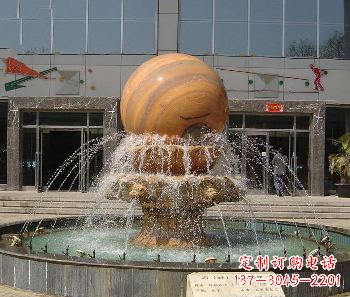 龙岩石来运转球晚霞红风水球石雕